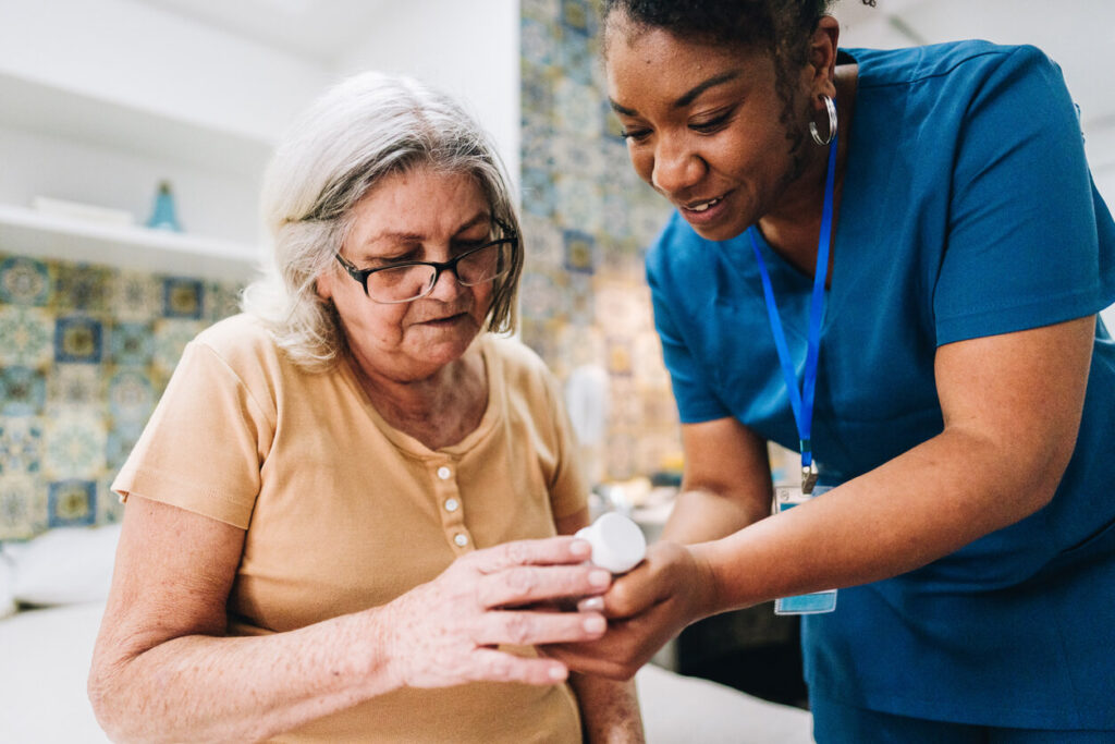 Nurse is showing a senior a perscription